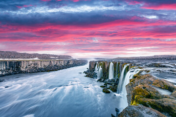 Colorful sunset on Famous Selfoss waterfall, Jokulsargljufur National Park, Iceland. Landscape...