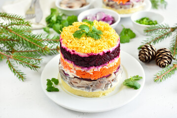 Obraz na płótnie Canvas Layered salad with beet, herring, carrots and potatoes