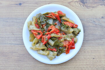 Meze or mezze is a selection of small dishes served as appetizers in much of West Asia, Middle East, and the Balkans. Meze is often served as a part of multi-course meals.