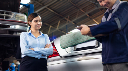 Portrait young business woman. Asian young woman customer talking with owner and mechanic worker at car repair service and auto store shop.