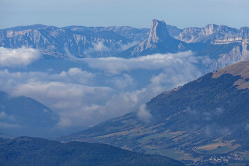 Clouds in Vercors mounatin range landscape with Mont Aiguille summit