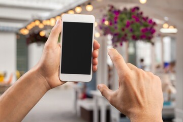 Human hand hold a phone with a blank screen