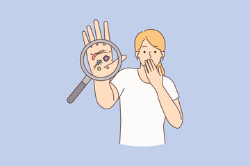 Stressed woman show bacteria under magnifier 