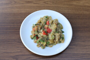 Meze or mezze is a selection of small dishes served as appetizers in much of West Asia, Middle East, and the Balkans. Meze is often served as a part of multi-course meals.