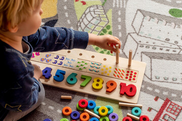 Baby toddler early development. Wooden stack and count rainbow colors learning game. Child learn colors and numbers