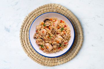Rice paella with turkey and vegetables. Healthy recipe.