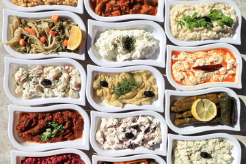 
​Meze or mezze is a selection of small dishes served as appetizers in much of West Asia, the Middle East, and the Balkans. Meze is often served as a part of multi-course meals.