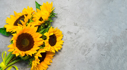 Bouquet of sunflower flowers on a gray concrete background