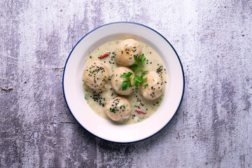 Fish meatballs with white wine sauce. Traditional tapas from Barcelona, ​​Spain.