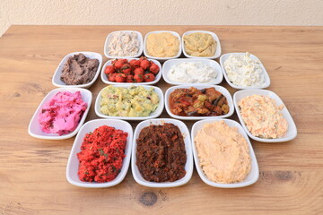 
​Meze or mezze is a selection of small dishes served as appetizers in much of West Asia, Middle East, and the Balkans. Meze is often served as a part of multi-course meals.