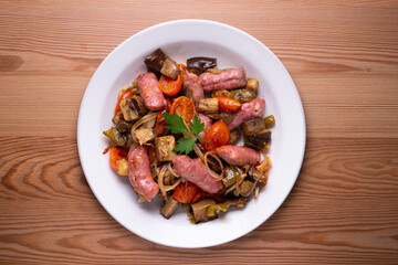 Iberian pork sausages sautéed with vegetables. Tapa typical center of Spain.