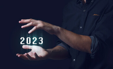 Man and a hologram 2023, New Year. Concept