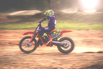 Fototapeta na wymiar person riding a motorcycle. Driver practicing on a motocross bike. on the off road