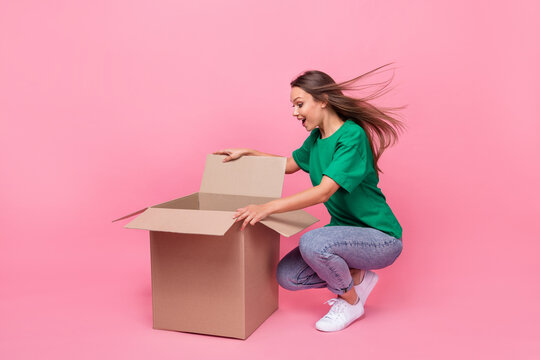 Full length photo of astonished person open shipment package isolated on pink color background