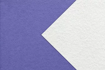 Papier Peint photo Pantone 2022 very peri Texture of very peri paper background, half two colors with white arrow, macro. Structure of craft violet cardboard.