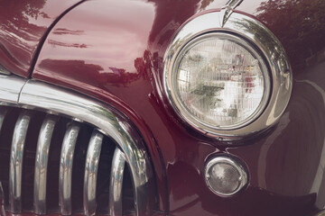 Detail of a vintage car. Close up of headlight retro classic car. Vintage effect style pictures....