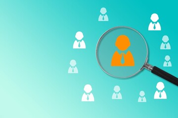 Magnifier glass on icon of human leader concept.