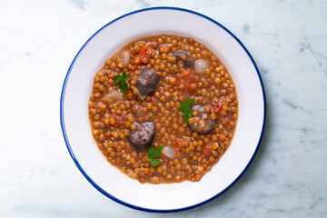 Lentils with chorizo ​​and black blood sausage. Typical Spanish recipe north of Spain.