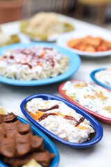 Meze or mezze is a selection of small dishes served as appetizers in much of West Asia, Middle East, and the Balkans. Meze is often served as a part of multi-course meals.