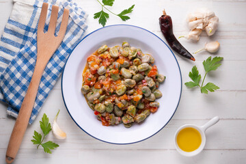 Beans with ham. Typical Spanish tapas recipe.