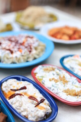
​Meze or mezze is a selection of small dishes served as appetizers in much of West Asia, Middle East, and the Balkans. Meze is often served as a part of multi-course meals.