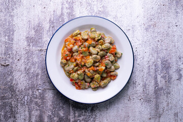Beans with ham. Typical Spanish tapas recipe.