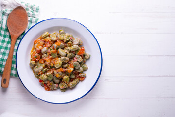 Beans with ham. Typical Spanish tapas recipe.