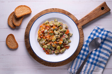 Beans with ham. Typical Spanish tapas recipe.