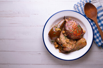Roast pork loin with pear. Typical Spanish tapa recipe.