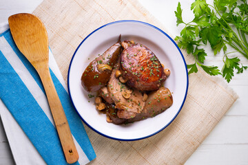 Roast pork loin with pear. Typical Spanish tapa recipe.