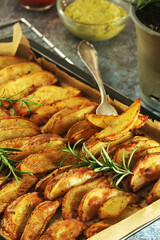 A tray with potatoes backed in oven	
