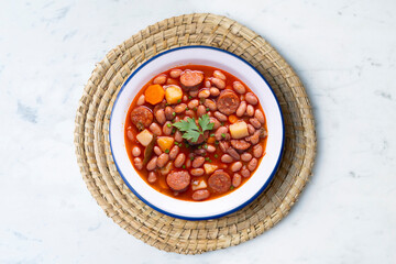 Asturian bean stew. Traditional recipe from the north of Spain with broad beans and chorizo.