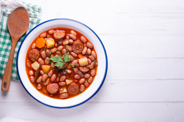Asturian bean stew. Traditional recipe from the north of Spain with broad beans and chorizo.