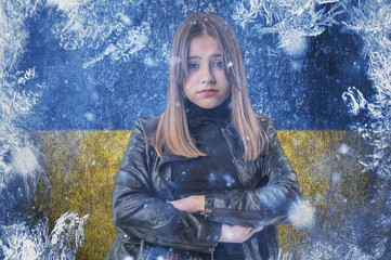 Teenage girl on frozen background with flag of Ukraine. Concept of crisis in Europe in winter....