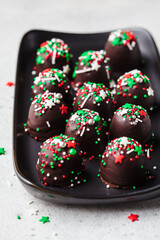 Christmas handmade chocolate balls with holiday sprinkles. DIY holiday gift.