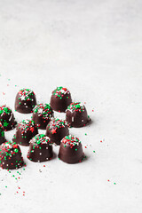 Christmas handmade chocolate balls with holiday sprinkles. DIY holiday gift.
