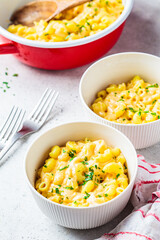 Mac and cheese in white bowl. Traditional American food.
