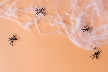 Spooky Halloween background with spider web and spiders. Autumn, Halloween or Thanksgiving season concept. orange color background with place for text