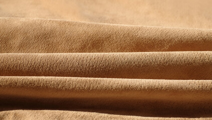 Suede leather waves close-up, texture of seamless sand leather