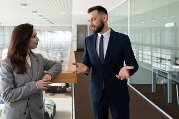 colleagues employees of the company communicate On the corridor discussing business issues