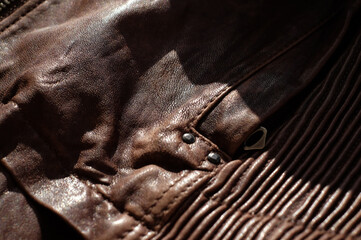 Details of jacket, brown leather close-up