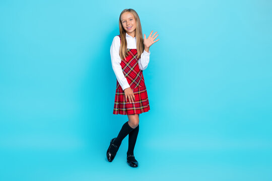 Full body size photo of little cute nice schoolgirl wear uniform showing five fingers hello world isolated on blue color background