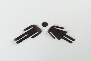 Male and female silhouette icons on white background. Symbolic man and woman.