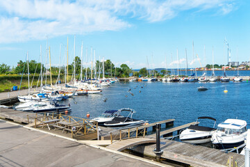 Fototapeta na wymiar Langelinie Marina with yachts and small boats in the city of Copenhagen, Denmark. Luxurious lifestyle