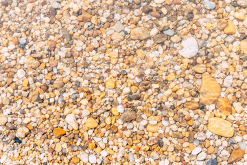 pebbles under water in river 