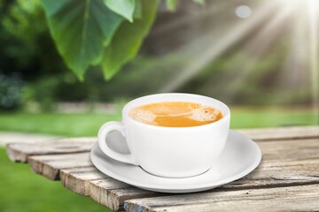 Cup of fresh aroma coffee on wooden table