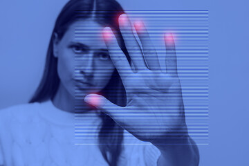 Woman's fingerprints on display, tinted blue, identification and security