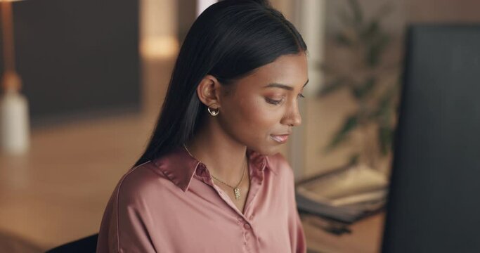 Night business woman working on computer in office at an international, global networking company in India. Online digital journalist typing article and research on media report or public relations