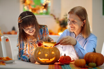 Family carving pumpkin for Halloween