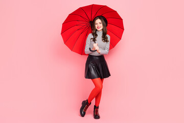 Photo of attractive stylish trendy lady hold parasol hiding rainstorm weather isolated pastel color background
